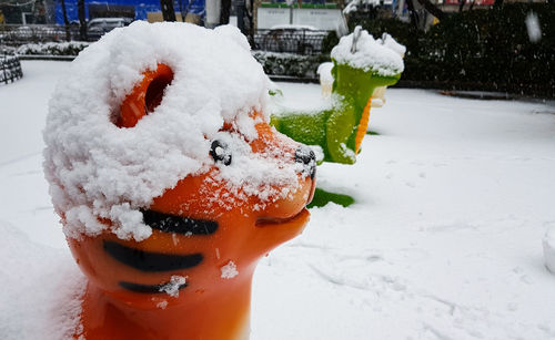 Close-up of ice cream on snow covered street