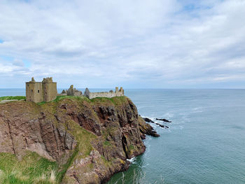 Scenic view of castle against sea and sky