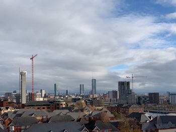 Modern buildings in city against sky