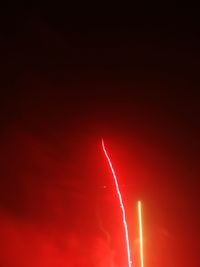 Low angle view of red lights at night