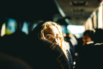 Portrait of woman sitting in bus