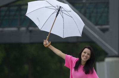 Portrait of woman holding umbrella