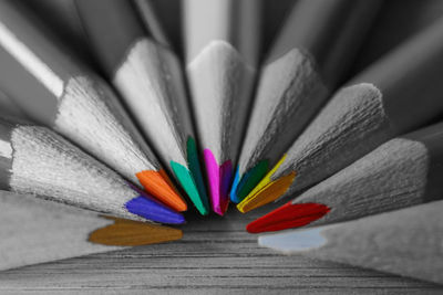 Close-up of multi colored pencils on table