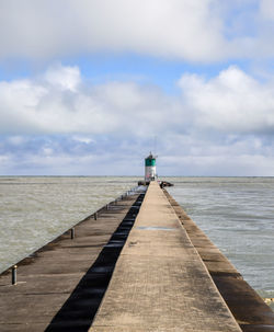 Pier over sea against sky