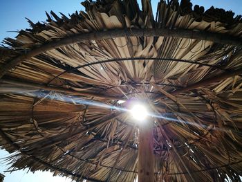 Low angle view of illuminated roof against sky on sunny day