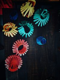 High angle view of multi colored umbrellas on paper