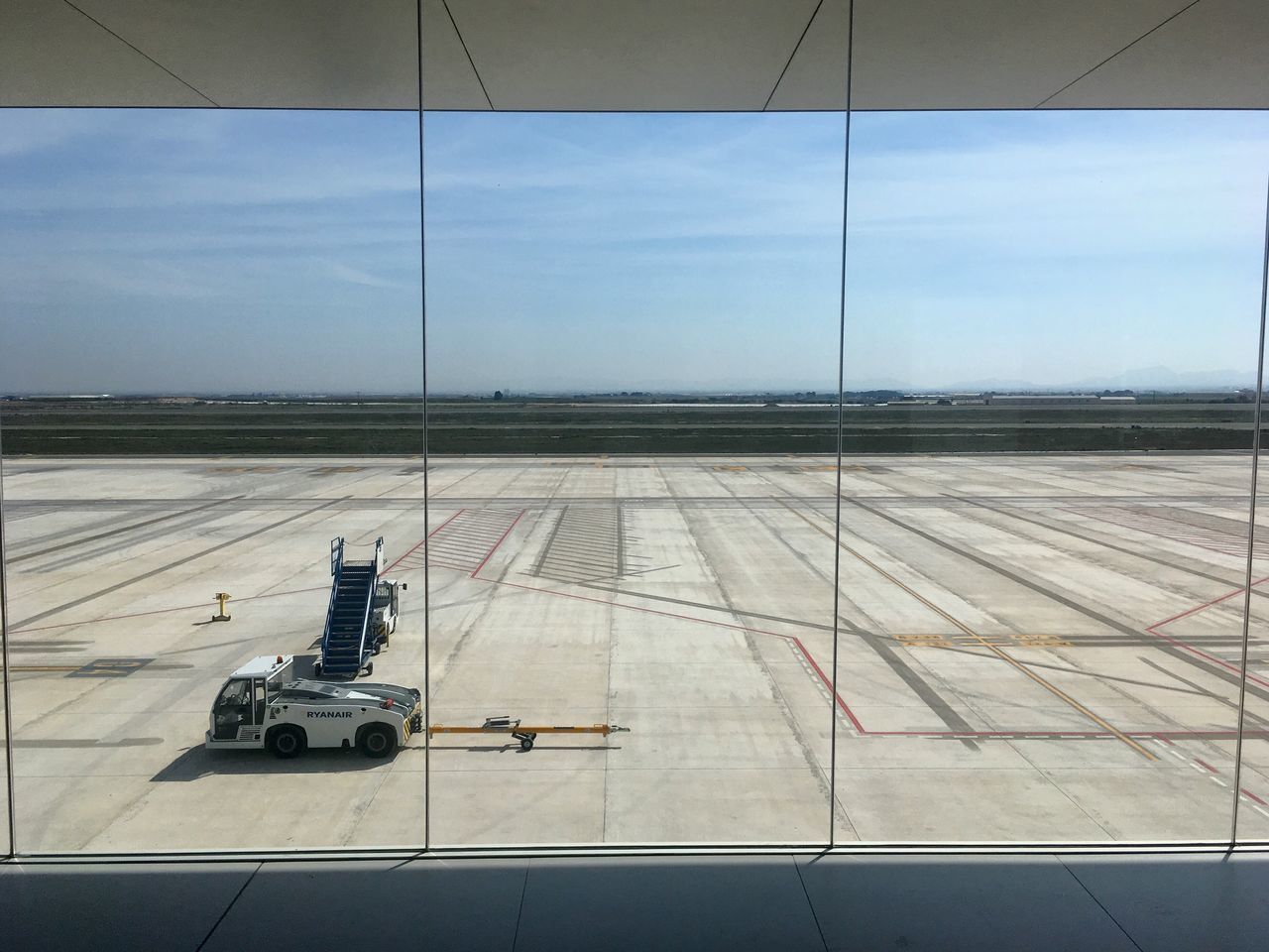 AIRPORT RUNWAY AGAINST SKY