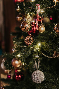 Close-up of christmas decorations hanging on tree