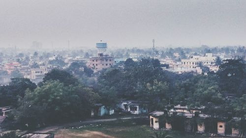 Buildings seen through wet window during rainy season