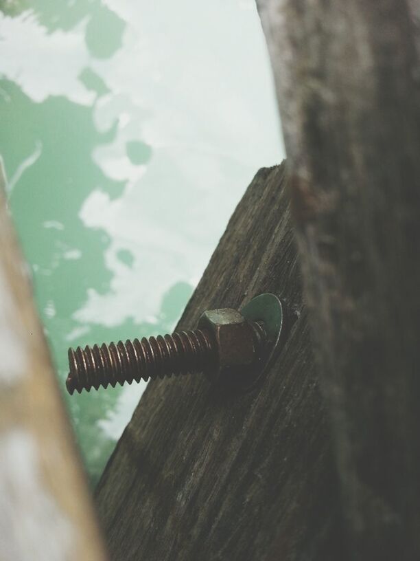 wood - material, focus on foreground, close-up, selective focus, wooden, metal, day, cropped, part of, wood, outdoors, sky, low angle view, no people, nature, tree, rusty, metallic, protection, rope