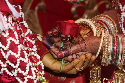 Midsection of bridegroom during wedding ceremony