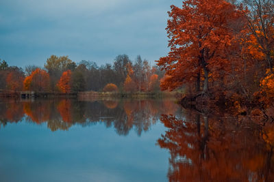 Reflection of trees in lake against sky during autumn