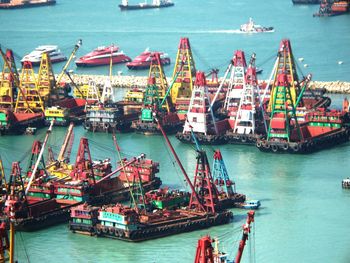 Boats moored at harbor