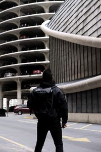 Rear view of man walking in city