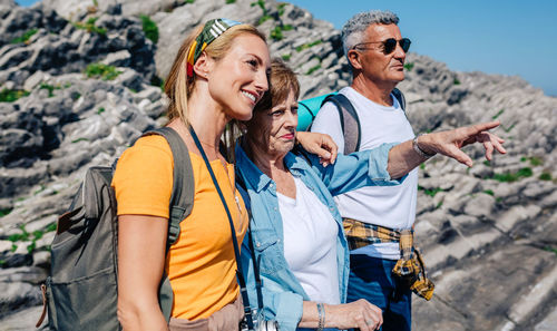 Woman trekking with her senior parents