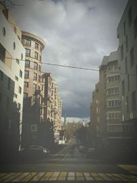 Road in city against sky