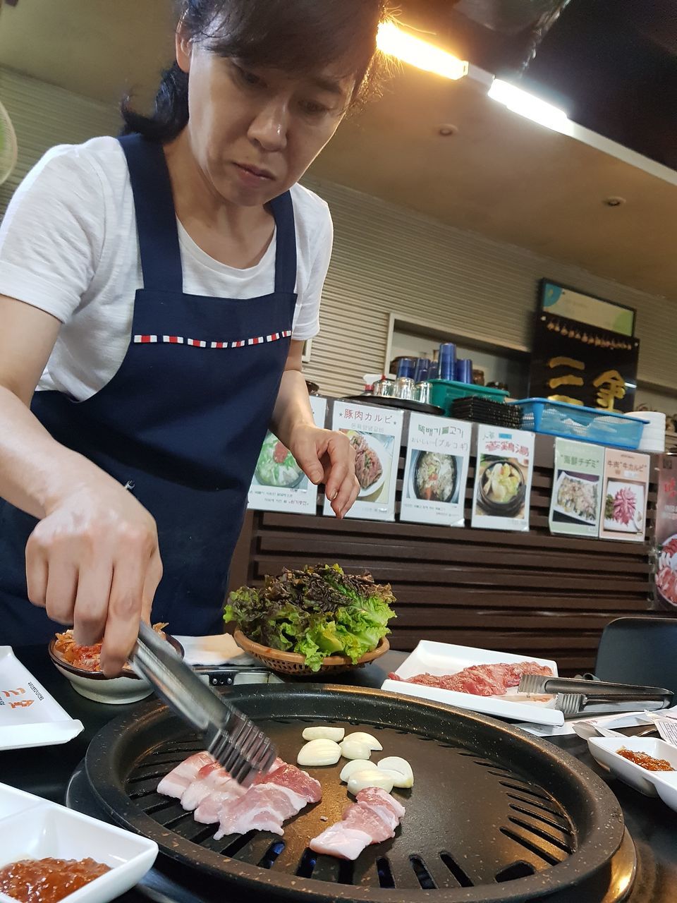 food and drink, food, real people, indoors, freshness, front view, one person, holding, young women, standing, young adult, occupation, ready-to-eat, day