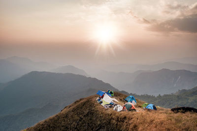 Hands outstretched to receive natural light and mountain views . hipster style. mulayit in myanmar