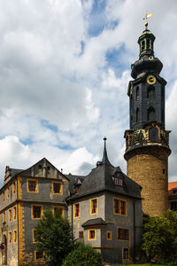 Low angle view of clock tower against sky