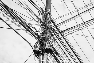 Low angle view of cables against clear sky