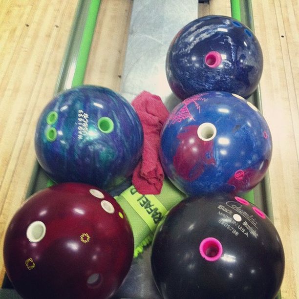 indoors, still life, ball, multi colored, close-up, childhood, human representation, toy, green color, celebration, art and craft, creativity, christmas, table, sphere, decoration, anthropomorphic face, variation, art, animal representation