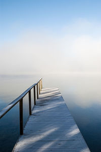 Pier over sea against clear sky