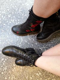 Low section of women wearing shoes