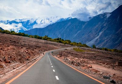 Road amidst mountains against sky