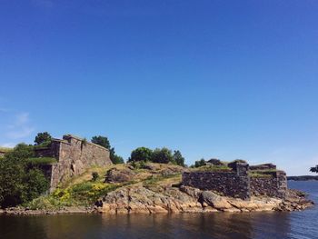 View of castle against clear blue sky