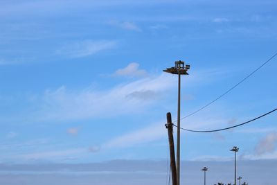 Low angle view of street light against sky