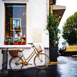 Bicycle against building in city