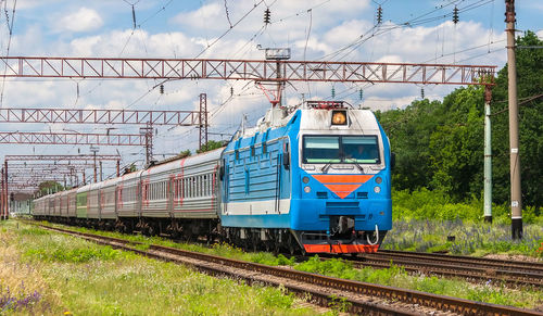 Train on railroad track against sky