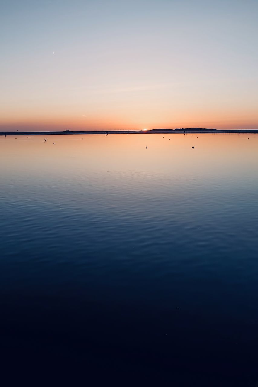 scenics - nature, sky, beauty in nature, water, tranquil scene, tranquility, sunset, waterfront, idyllic, reflection, non-urban scene, no people, sea, orange color, nature, copy space, outdoors, silhouette, romantic sky