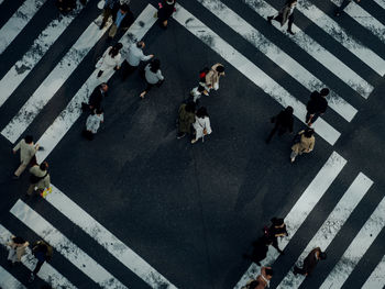 High angle view of people crossing road