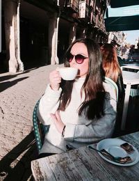 Woman drinking coffee cup