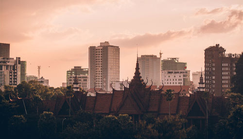 Cityscape against sky during sunset