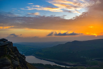 Scenic view of mountains against sky during sunset