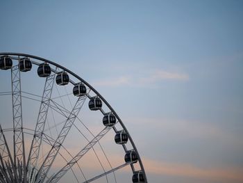 Low angle view of ferris wheel against sky