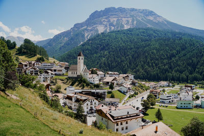 High angle view of townscape and mountains against sky