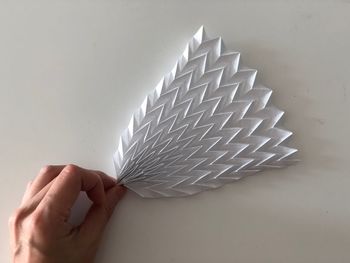 Close-up of hand holding umbrella