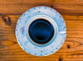 High angle view of coffee cup on table