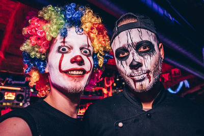 Portrait of smiling friends in halloween costume