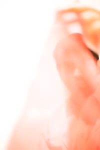 Close-up of hands over white background