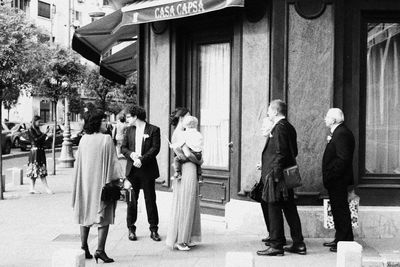 Group of people walking in front of building