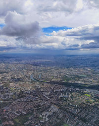 High angle view of city against cloudy sky
