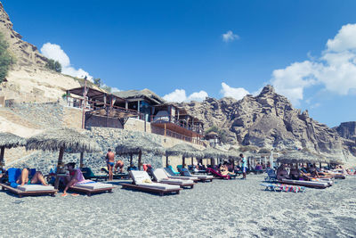 Panoramic view of boats moored against blue sky