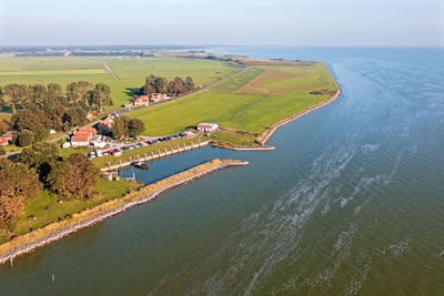 Aerial from the little old village and harbor from laaxum at the ijsselmeer in the netherlands