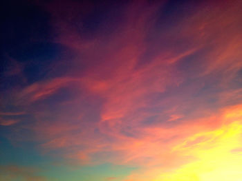 Low angle view of cloudy sky at sunset