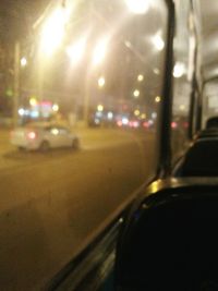 Close-up of illuminated car windshield at night
