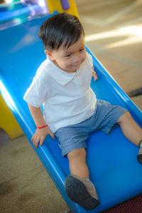 High angle view of boy playing on playground